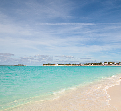 Pale sand and blue water at Treasure Cay Beach on Great Abaco
